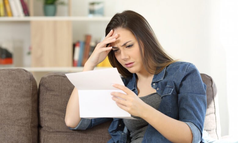 Person reading a letter showing signs that you will be denied for disability benefits